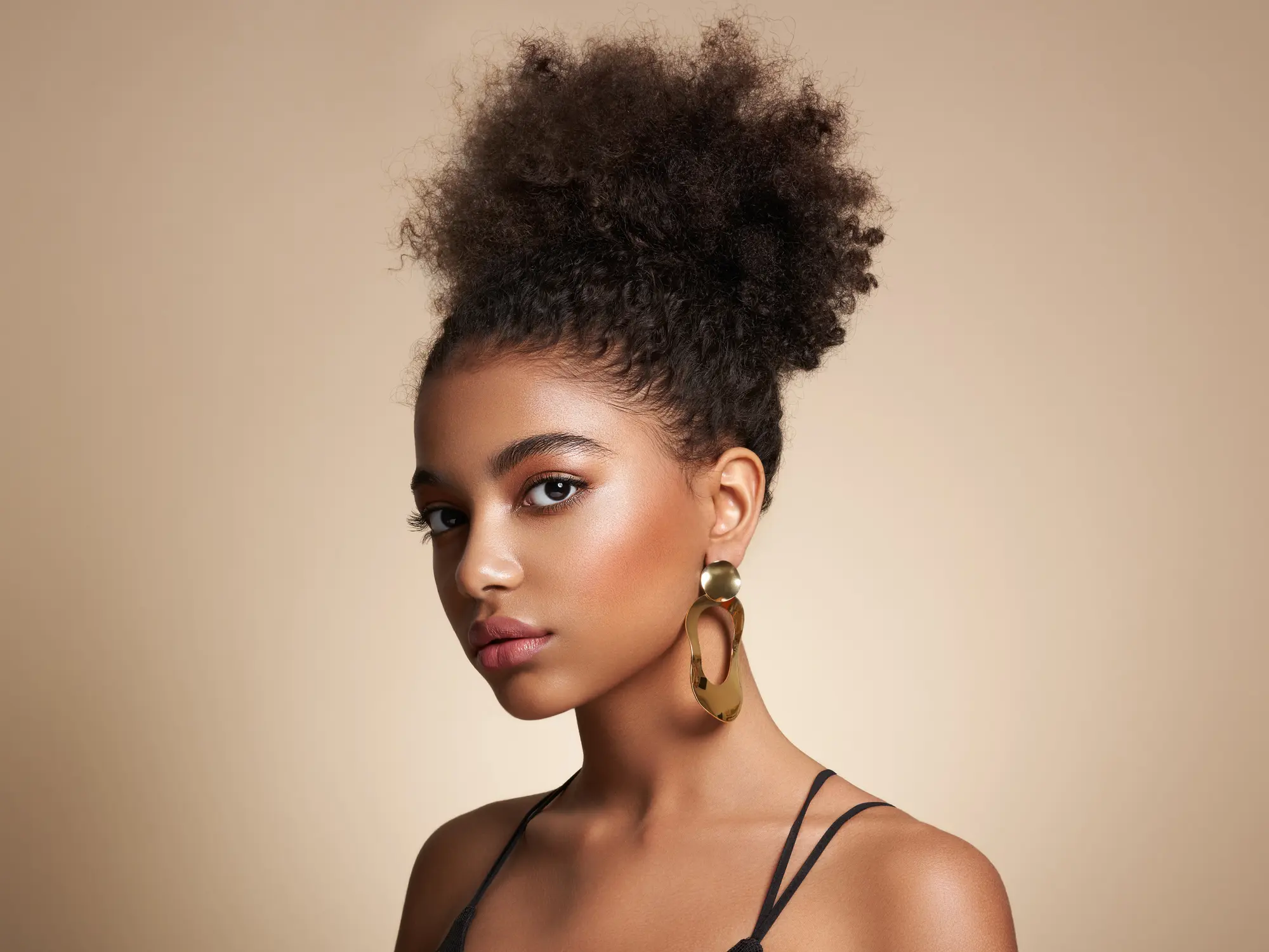 Beauty portrait of African American girl with afro hair Facials in West Palm Beach and Jupiter, FL