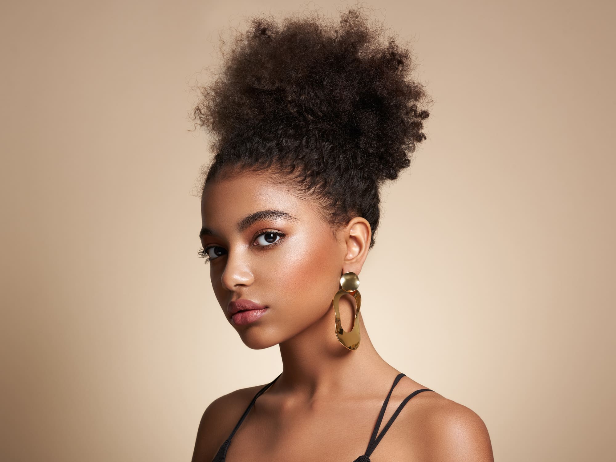 Beauty portrait of African American girl with afro hair Facials in West Palm Beach and Jupiter, FL